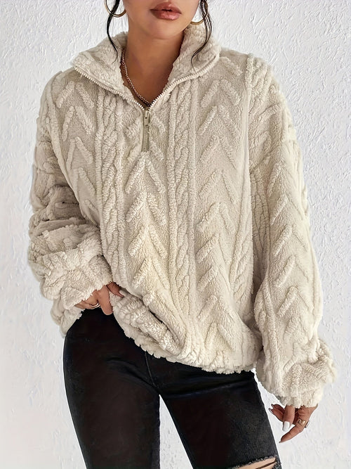 Cream chevron-textured sherpa half-zip pullover with a cropped boxy fit, stand collar, and gathered sleeves.