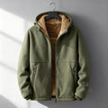 Olive green sherpa-lined jacket displayed on a hanger, featuring a zip-front closure, warm lining, long sleeves, and relaxed silhouette.