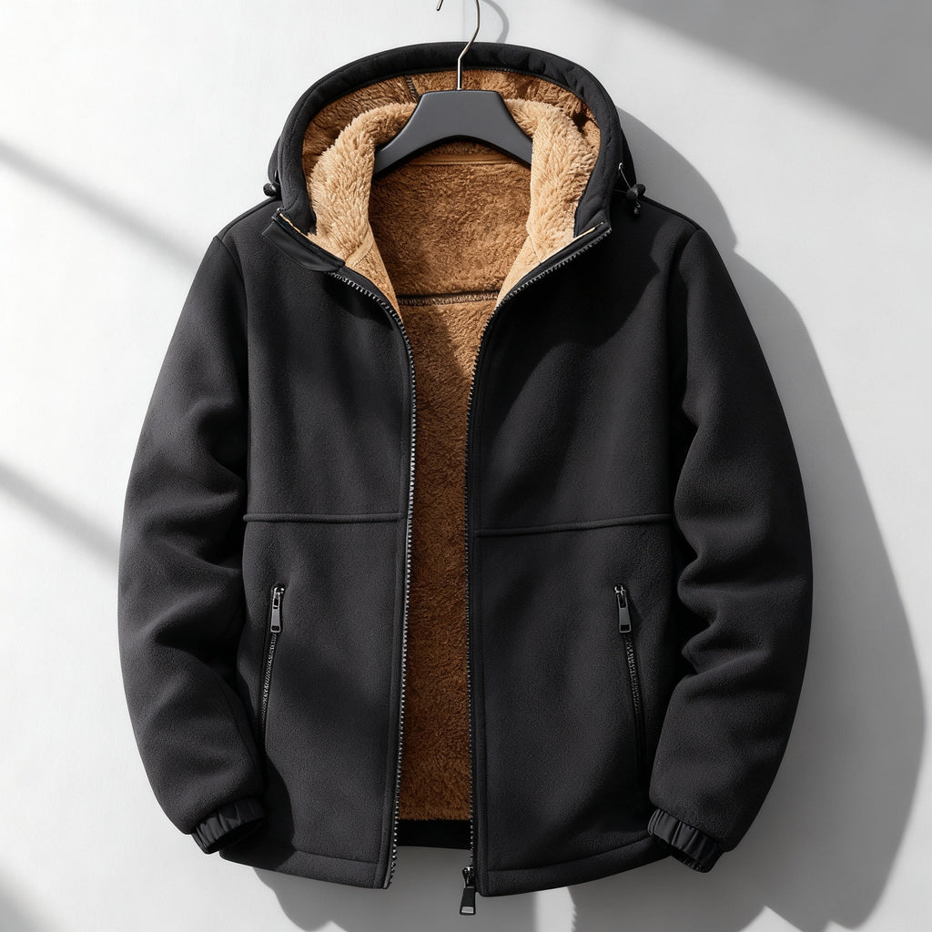 Black sherpa-lined jacket displayed flat, featuring a plush interior lining, front zip closure, and long sleeves.