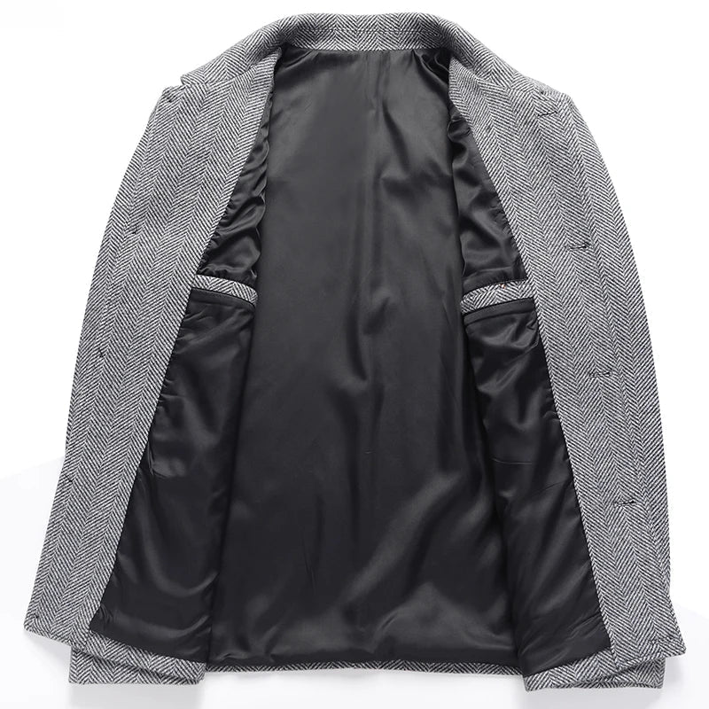 Interior view of a men's gray textured wool jacket showing the smooth black lining and structured construction.