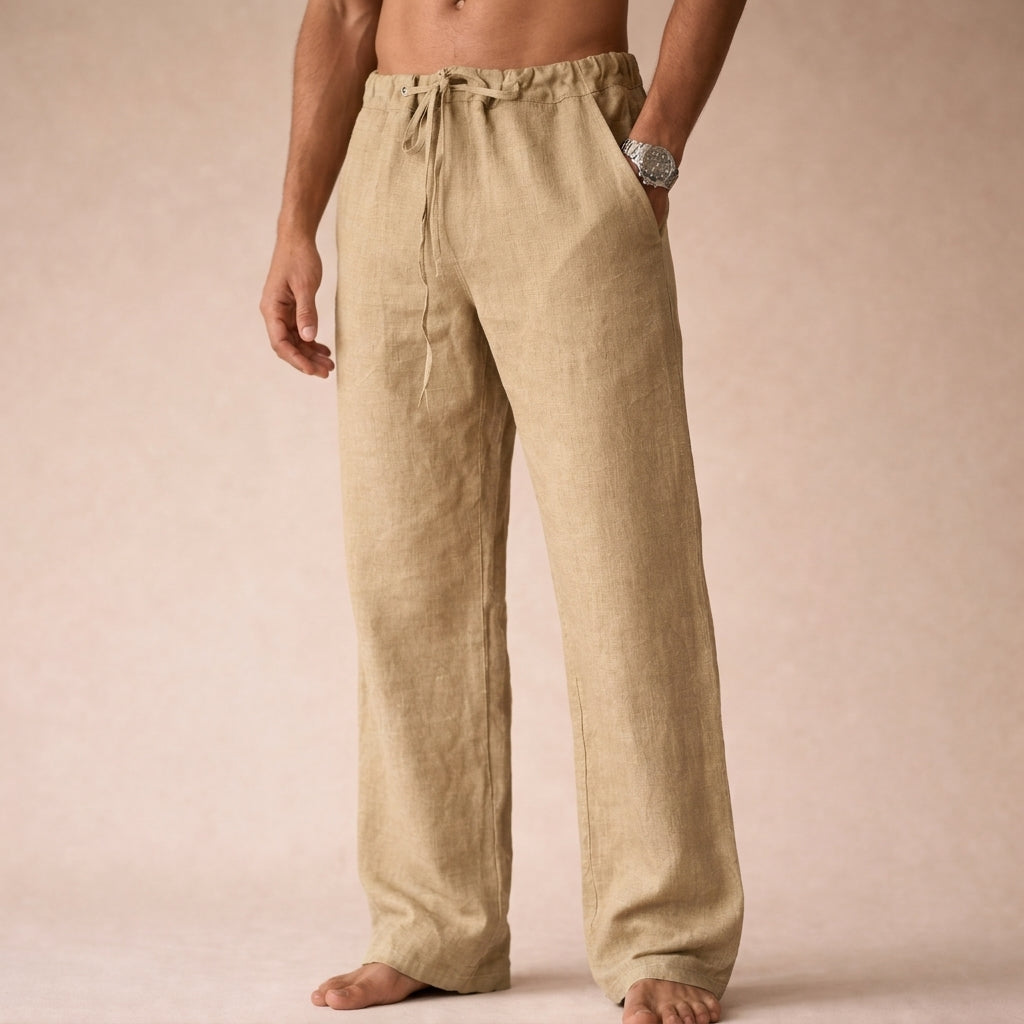 Men's beige linen drawstring pants with an elastic waistband, loose straight-leg fit, and lightweight linen construction.