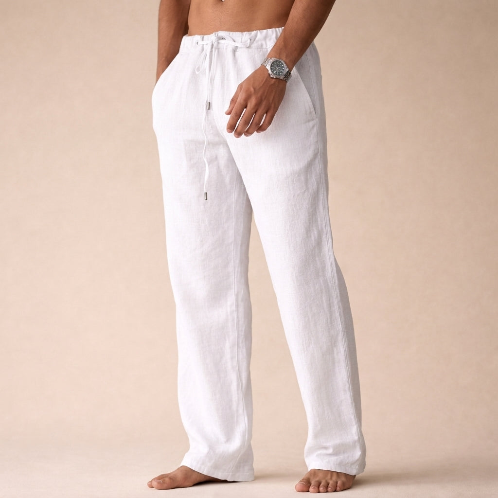 Men's white linen drawstring pants with a relaxed wide-leg fit and elastic waistband.