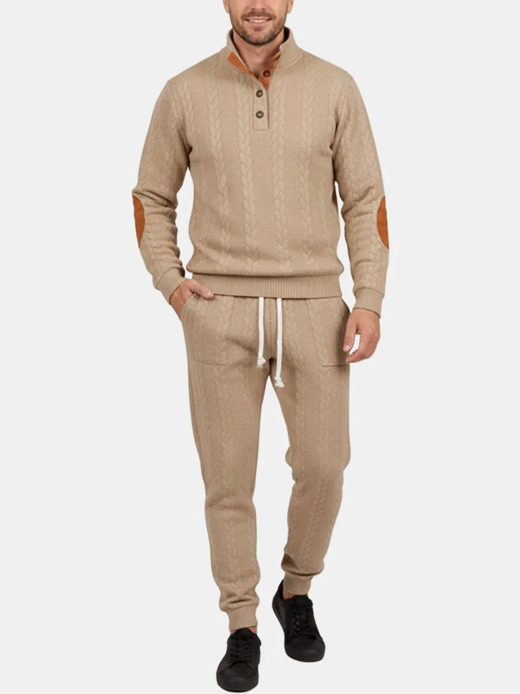 Man wearing a khaki quarter-zip sweatshirt with matching jogger pants in a coordinated casual outfit.