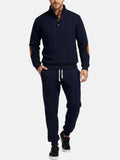 Men's navy quarter-zip sweatshirt with matching jogger pants featuring a drawstring waistband and relaxed athletic fit.