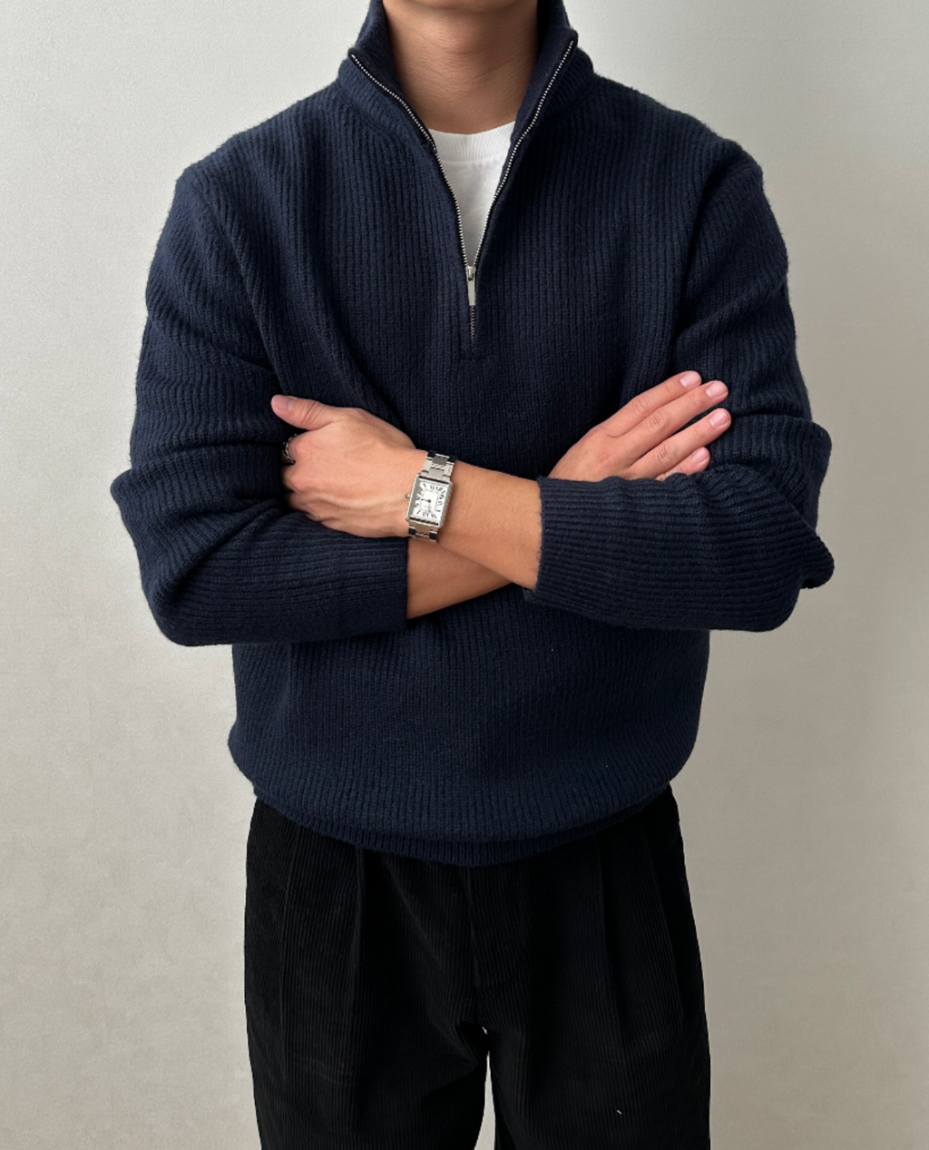 Navy blue brushed rib-knit quarter-zip sweater with a stand collar and regular fit, worn over a white tee.