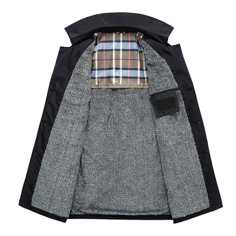 Black double-breasted trench coat featuring a warm grey fleece lining and a classic checked interior neck panel.