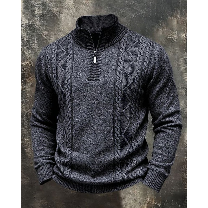 Dark gray cable-knit quarter-zip sweater featuring textured diamond panels, a ribbed stand collar, and ribbed trim.