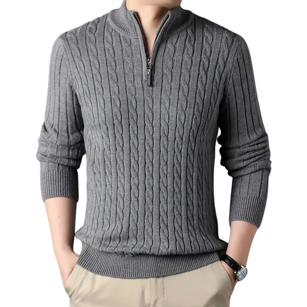 Gray cable knit quarter-zip sweater with a ribbed mock neck and tailored fit, worn with beige chinos.