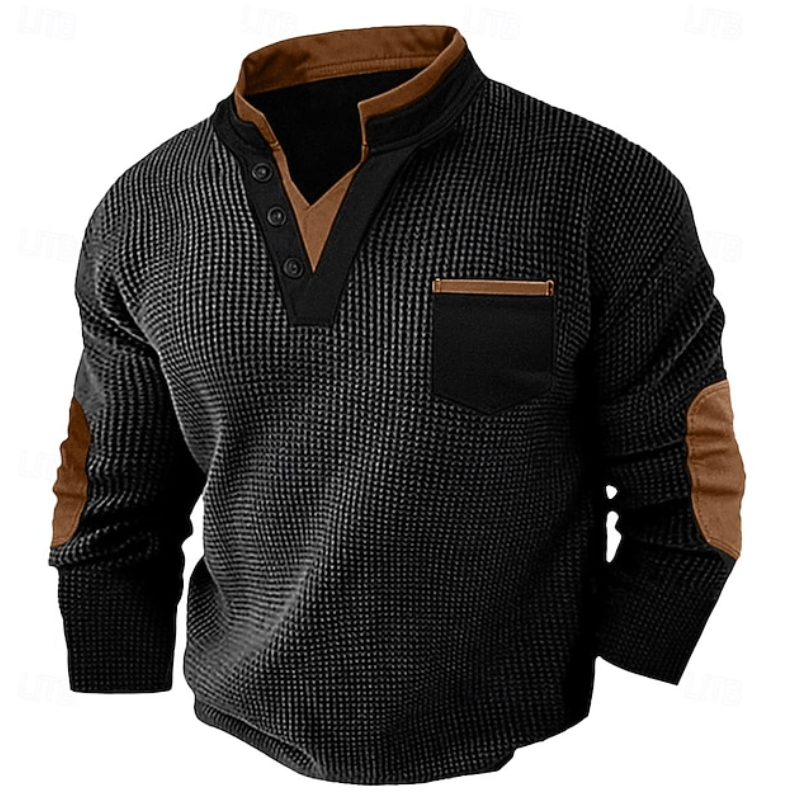 Men's black waffle knit Henley sweater featuring a stand collar, contrast trim, chest pocket, and faux suede elbow patches.