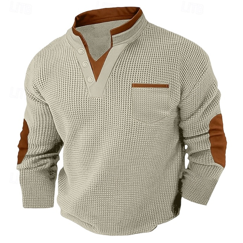 Men's cream waffle knit Henley sweater with a stand collar, contrast trim, chest pocket, and elbow patches.