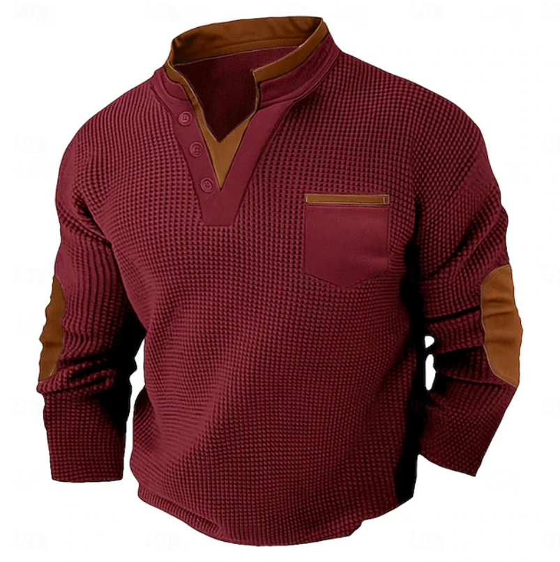 Men's burgundy waffle knit Henley sweater featuring a stand collar, chest pocket, contrast trim, and faux suede elbow patches.