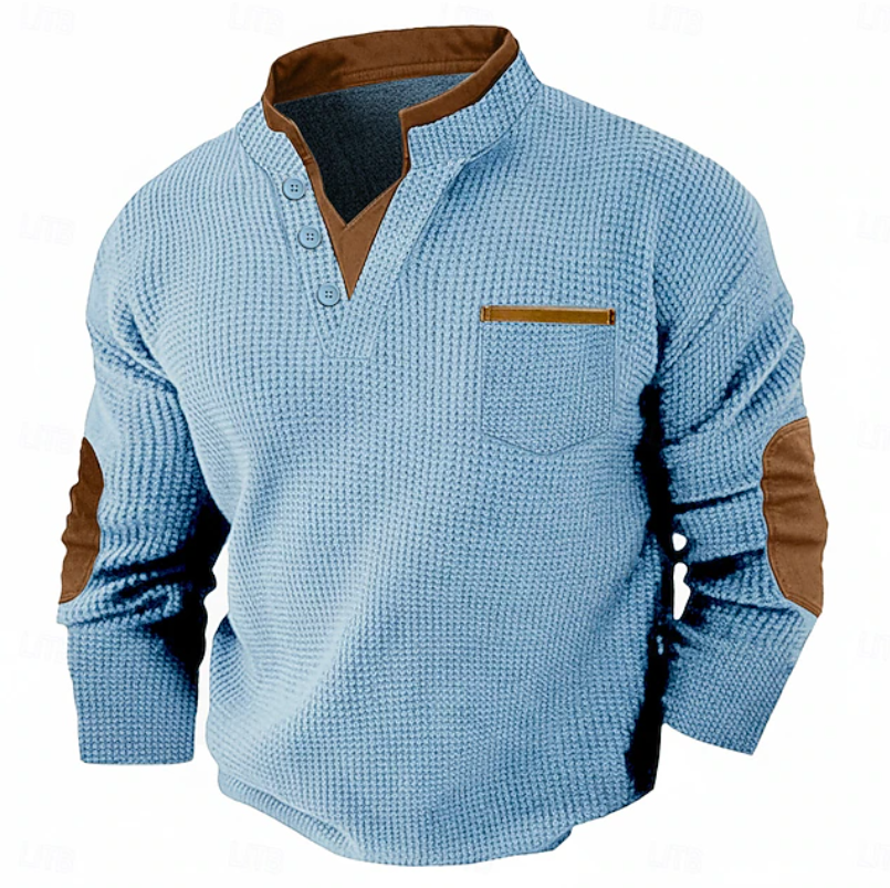 Men's light blue waffle knit Henley sweater featuring a stand collar, chest pocket, elbow patches, and textured fabric.