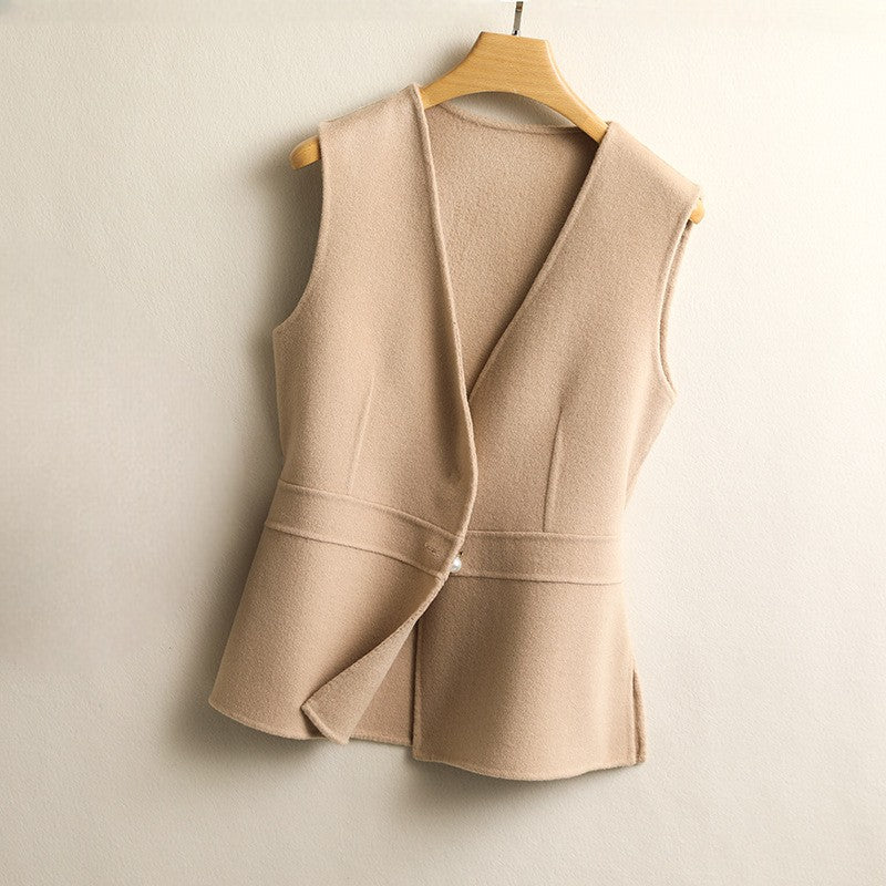 Back view of a women's taupe sleeveless wrap sweater vest with a tailored fit and peplum hem.