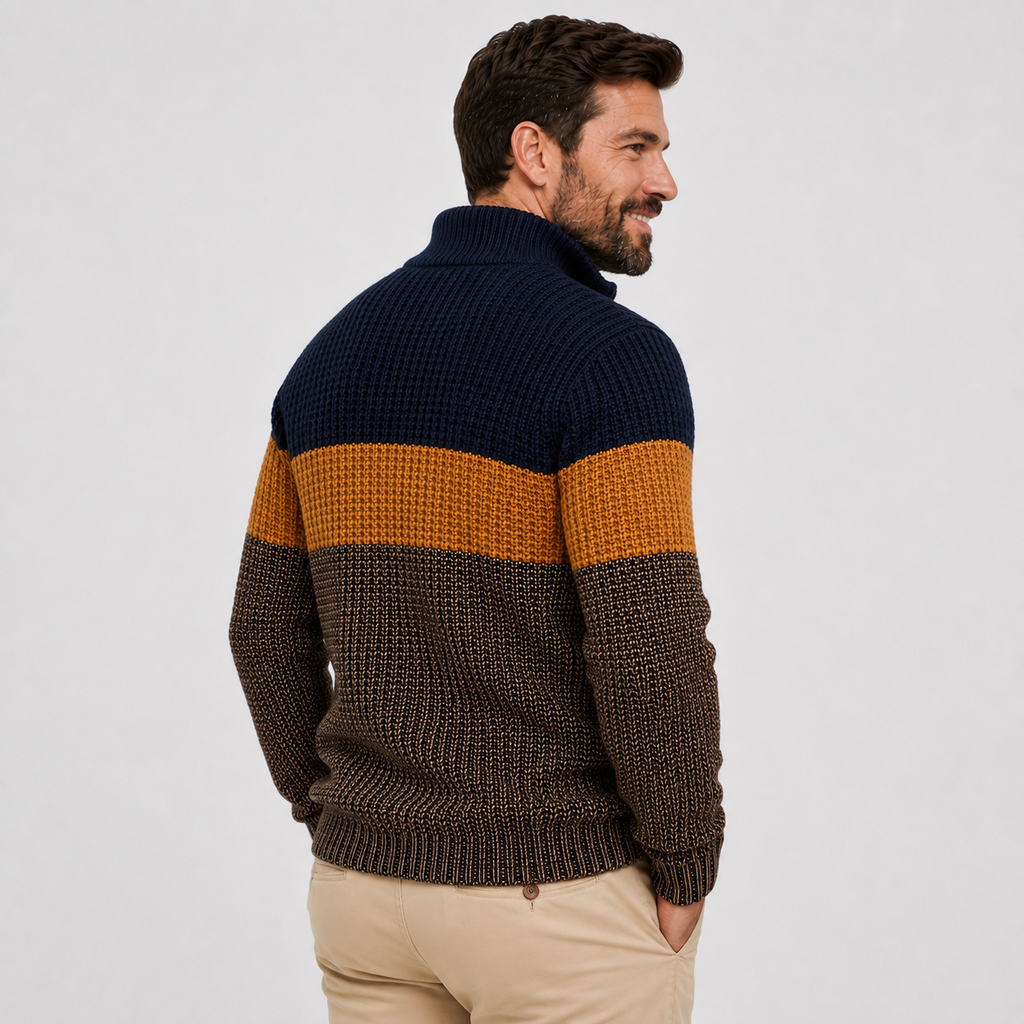 Chunky knit quarter-zip sweater with navy, ochre, and brown colorblock stripes, featuring a stand collar and ribbed trim.