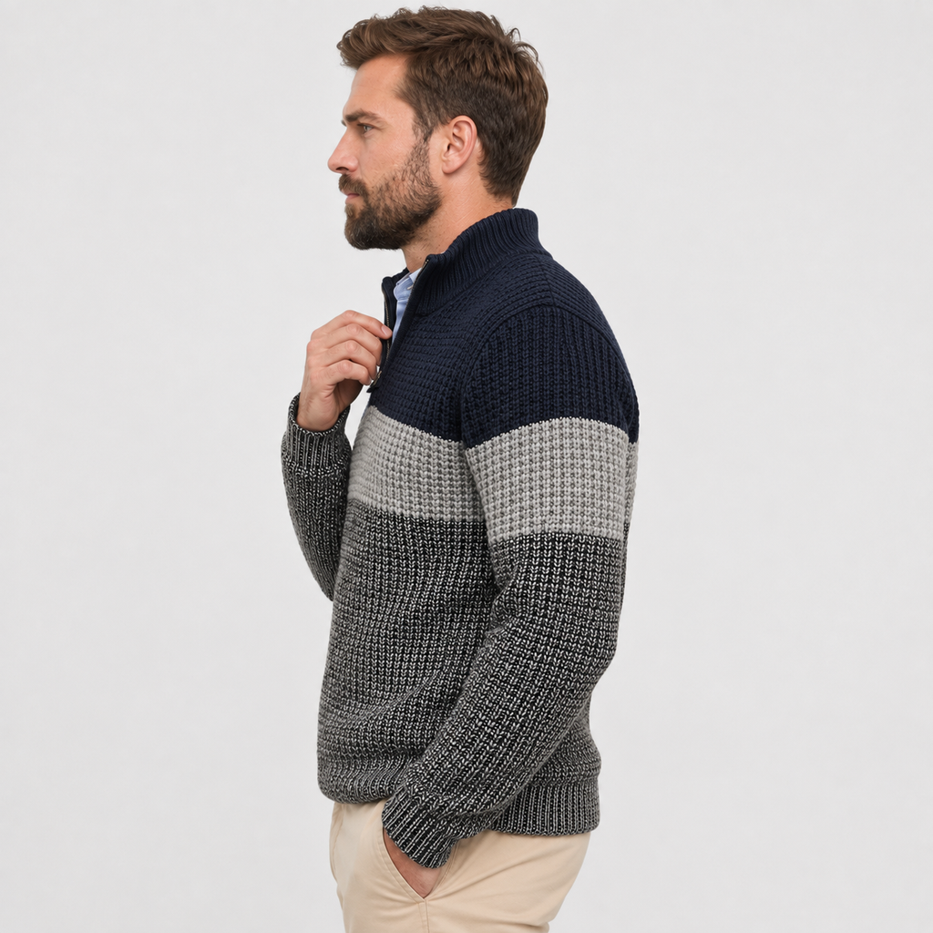 Chunky knit quarter-zip sweater in navy and grey colorblock stripes with a ribbed stand collar and textured heavy-gauge knit.
