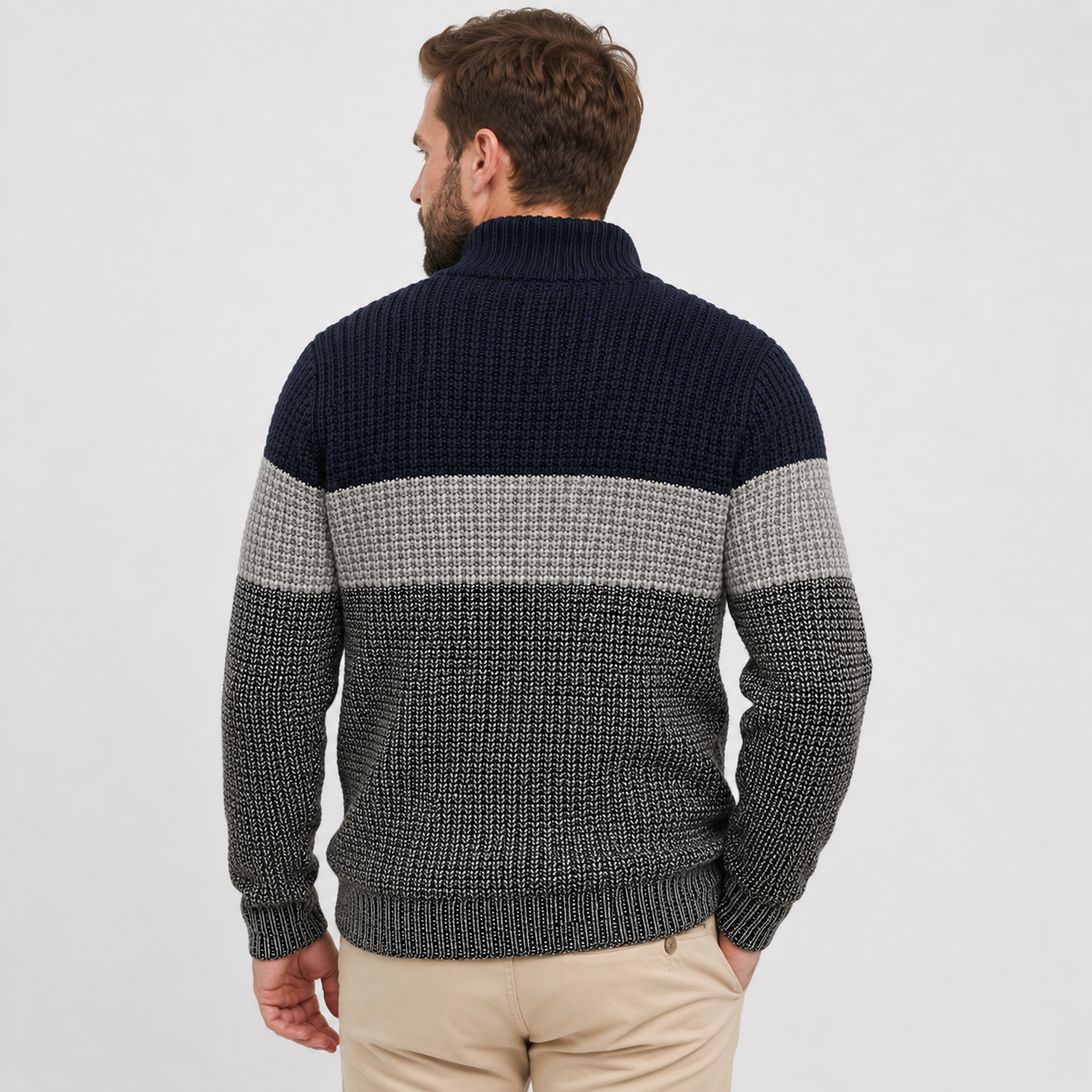 Chunky knit quarter-zip sweater featuring navy, grey, and charcoal colorblock stripes with a ribbed stand collar.
