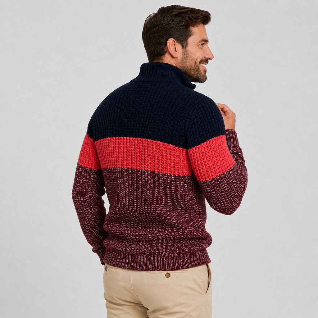 Chunky knit quarter-zip sweater featuring navy, red, and burgundy colorblock stripes with a ribbed stand collar.