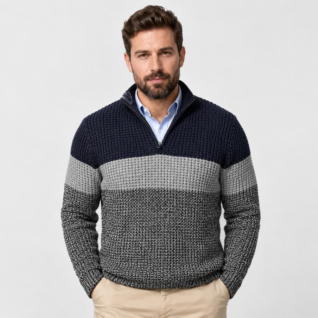 Chunky knit quarter-zip sweater with navy and grey colorblock stripes, stand collar, and ribbed trim over a button-down.