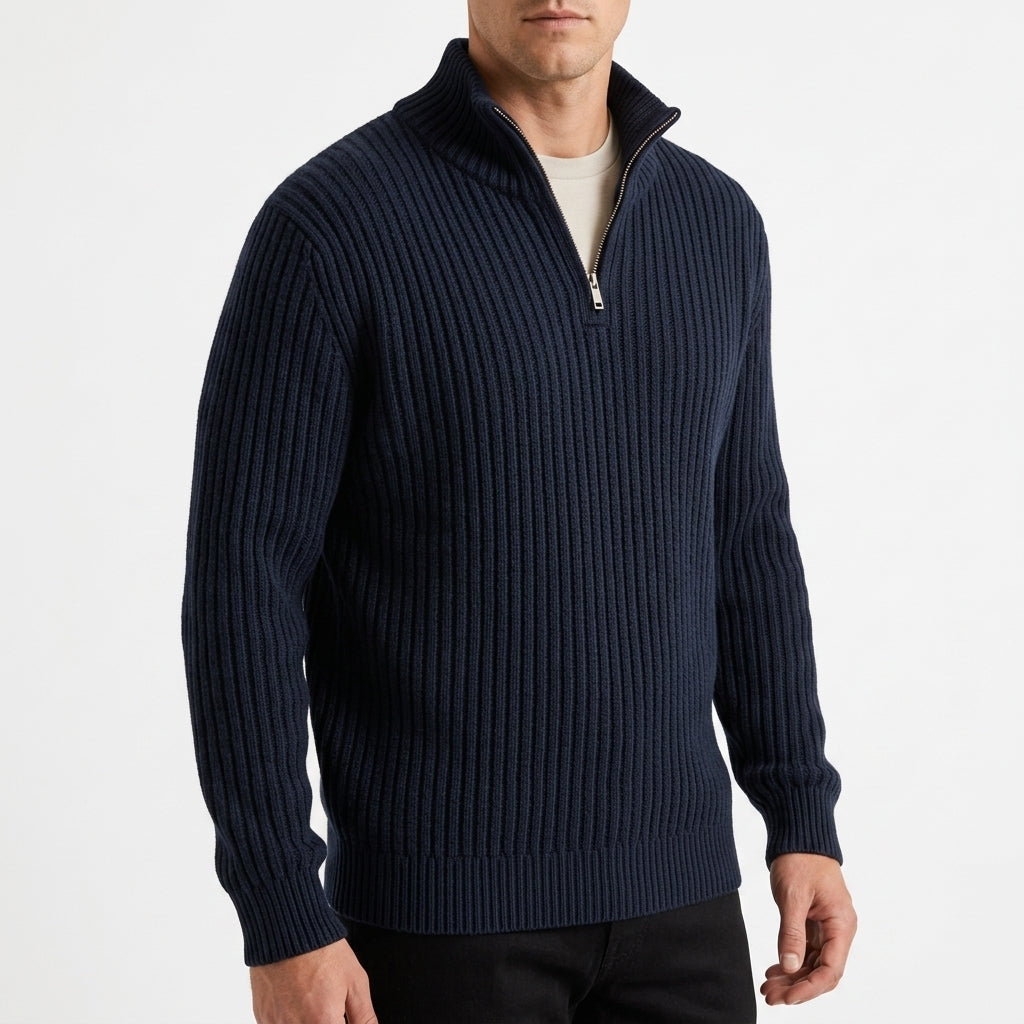 Navy blue chunky ribbed quarter-zip sweater in heavyweight knit with a high stand collar and metal zipper.