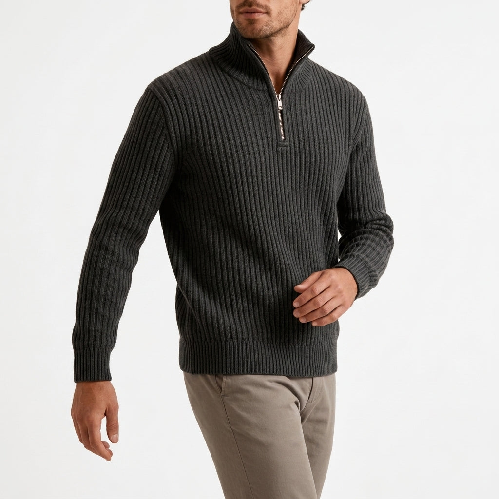 Dark gray chunky ribbed quarter-zip sweater in heavyweight knit with a high stand collar and metal zipper.