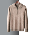 Tan marled mid-weight knit quarter-zip sweater with a ribbed polo collar, cuffs, and hem hanging on a wooden hanger.