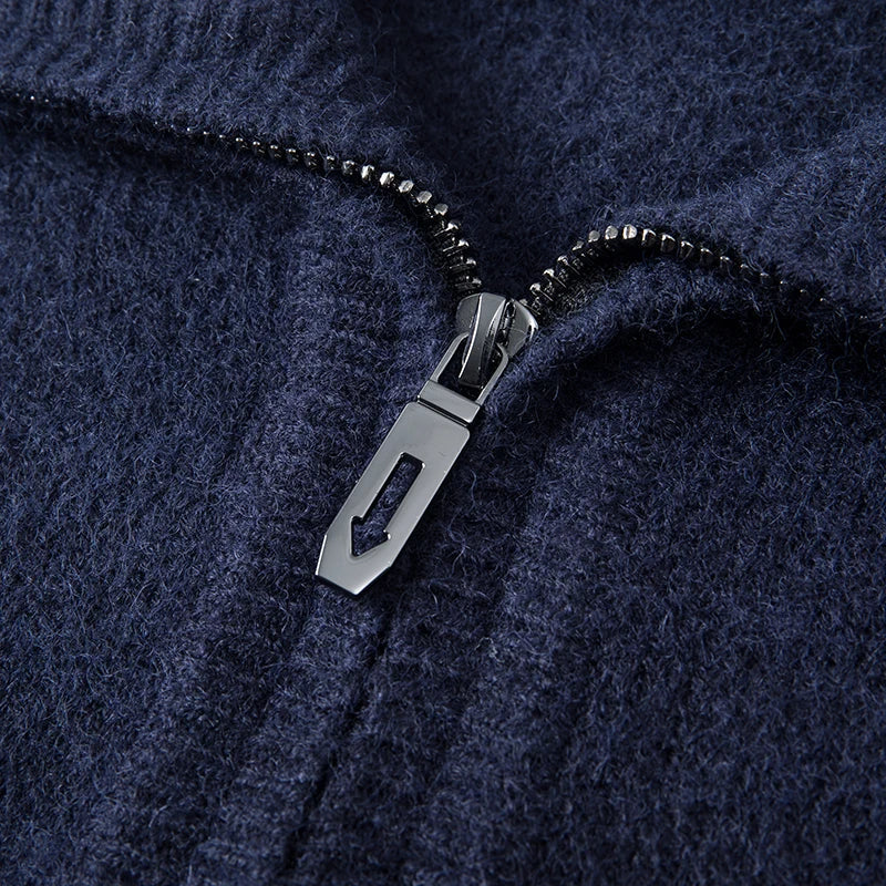 Navy blue mid-weight marled knit quarter-zip sweater featuring a textured finish and a polished metal zipper pull.