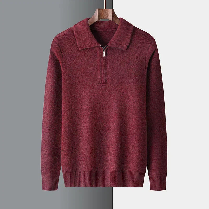 Marled burgundy quarter-zip sweater in mid-weight knit with a ribbed polo collar, cuffs, and hem hanging on a hanger.