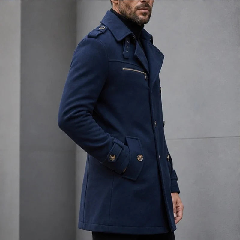 Navy blue cotton-blend trench coat with shoulder epaulettes, zip chest pocket, and buttoned cuffs in a tailored fit.
