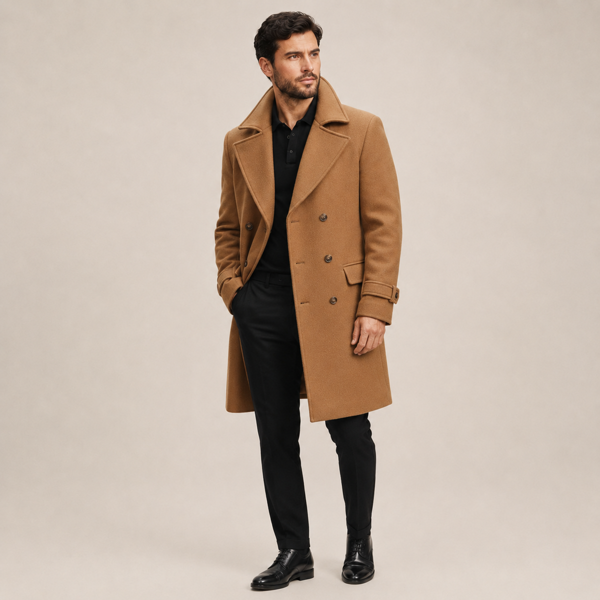Camel wool-blend double-breasted overcoat with notched lapels and structured shoulders worn over black separates.