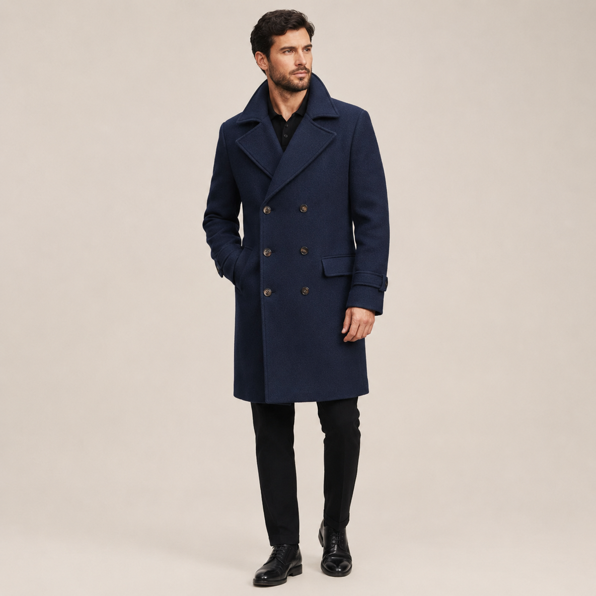 Navy blue wool-blend double-breasted overcoat with wide notched lapels and a structured, tailored fit.