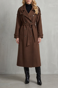 Brown wool trench coat with a double-breasted front, notched lapels, and a belted waist in an oversized longline fit.
