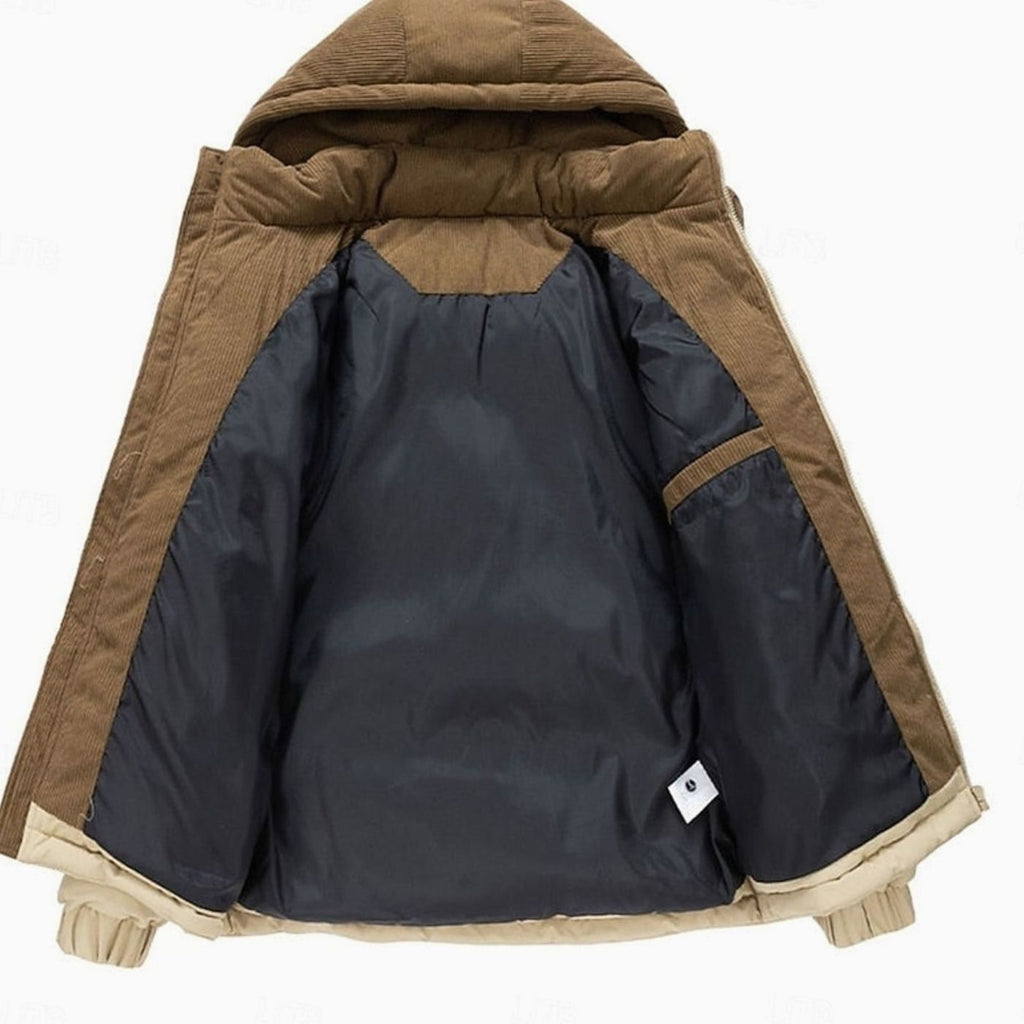 Interior view of a two-tone corduroy-trim hooded puffer jacket showing the quilted lining