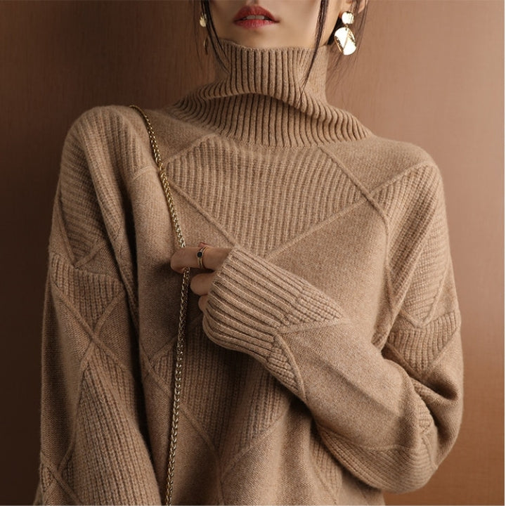 Woman wearing a brown ribbed turtleneck knit sweater with long sleeves, textured knit pattern, and a relaxed fit.