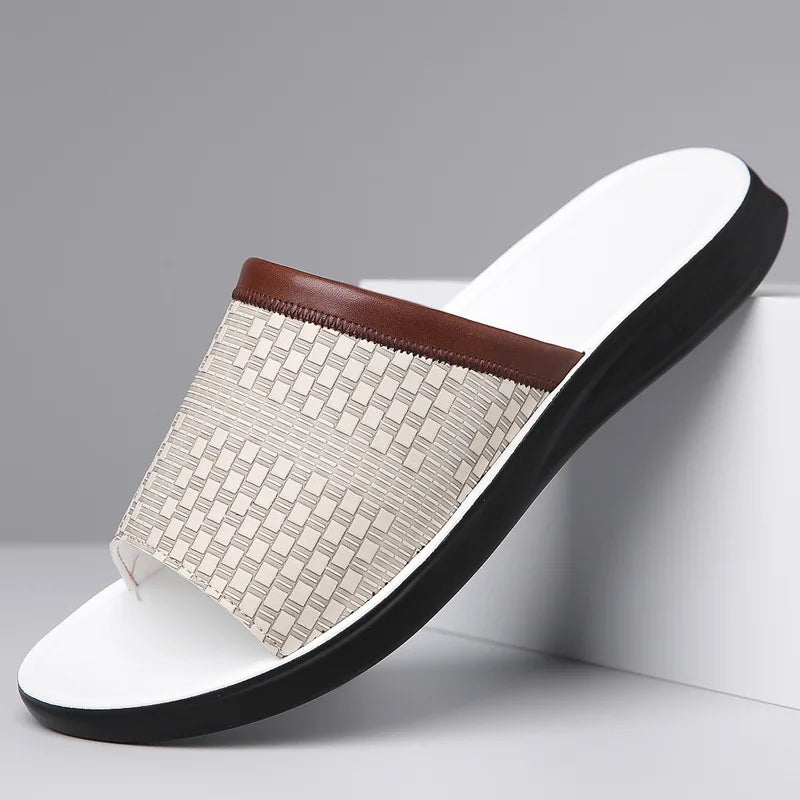 White woven-texture leather slide sandal with a brown leather trim strap and matching white molded sole, angled on a white display block.