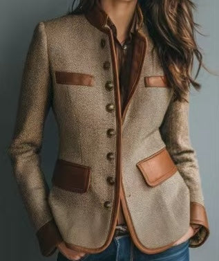 Woman wearing a taupe tweed blazer with contrasting brown trim, button-front closure, patch pockets, and tailored fit.