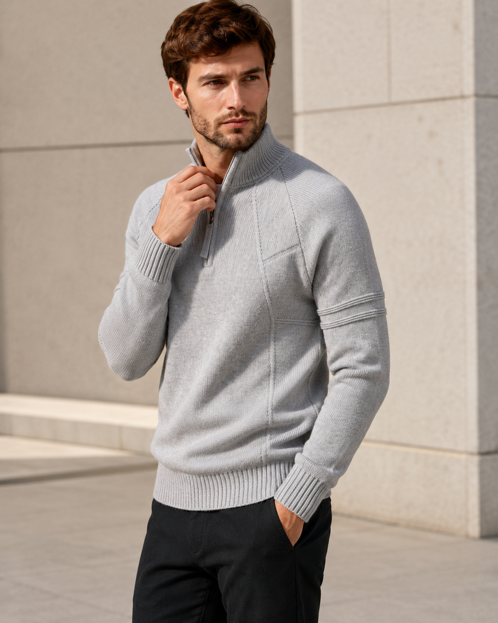 Fitted light gray knit quarter-zip sweater with seamed chest panels, raglan sleeves, and ribbed trim.