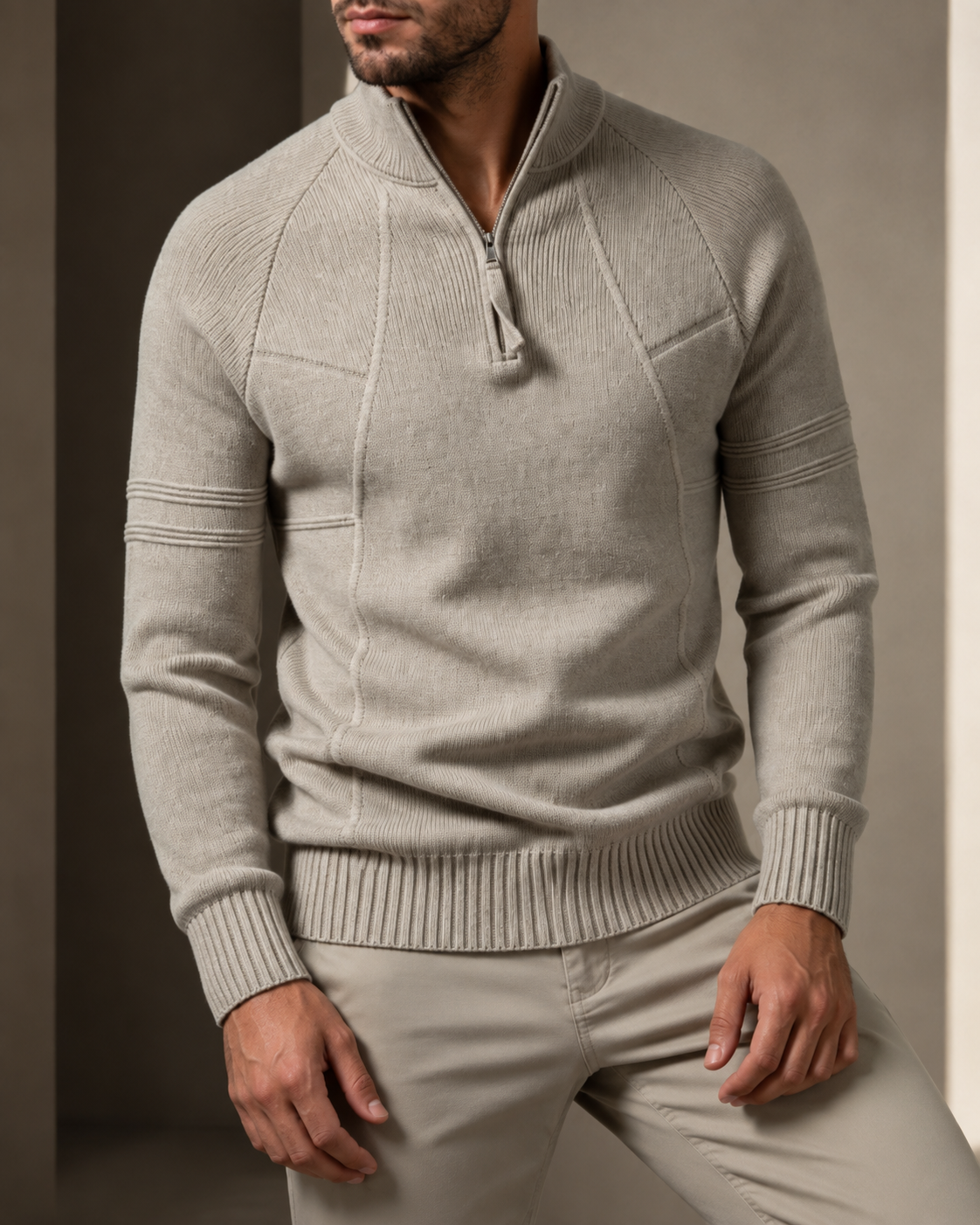 Fitted Beige knit quarter-zip sweater featuring raglan sleeves, raised chest seams, and ribbed cuffs.