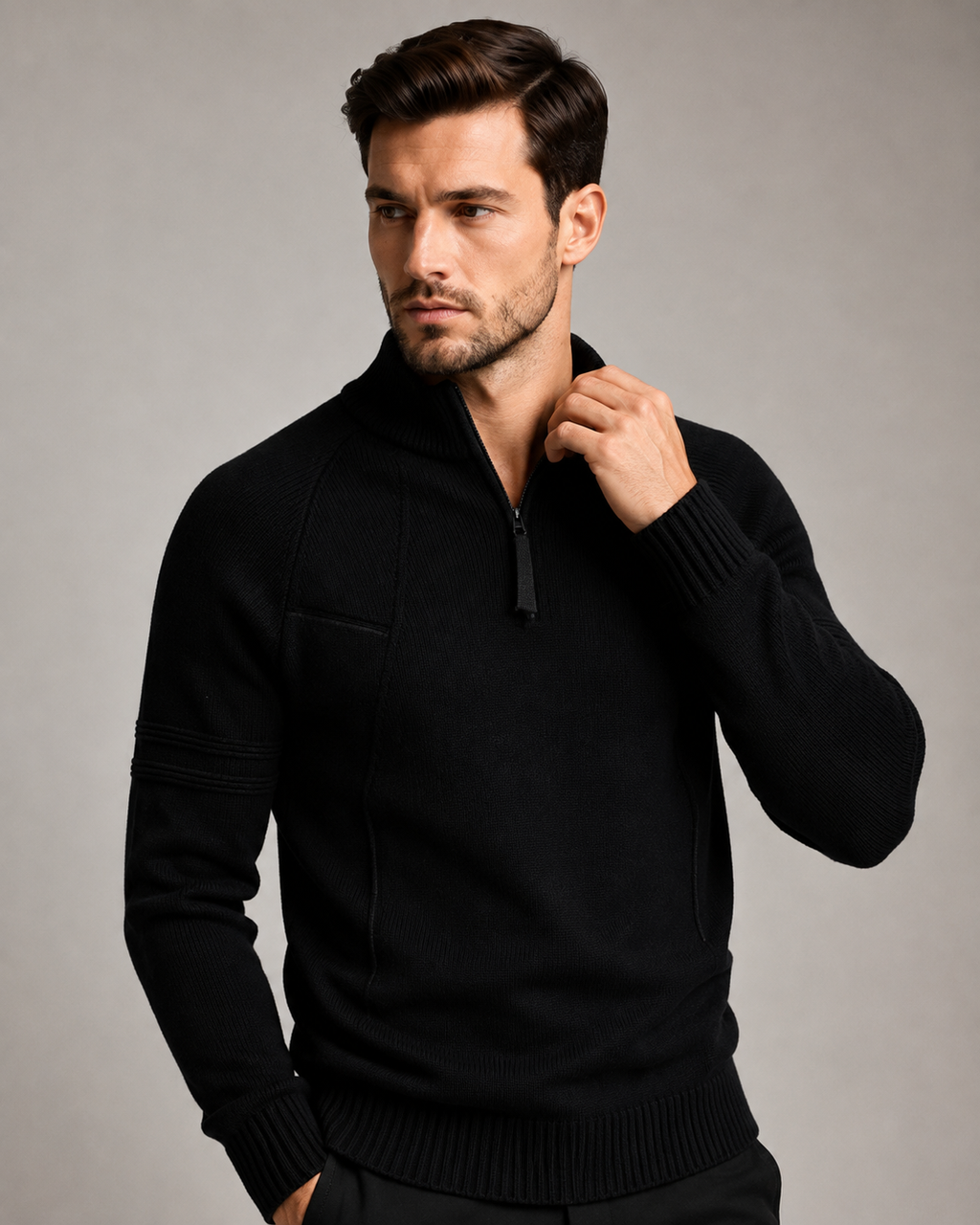 Black fitted knit quarter-zip sweater featuring raglan sleeves, raised chest seams, and ribbed cuffs.