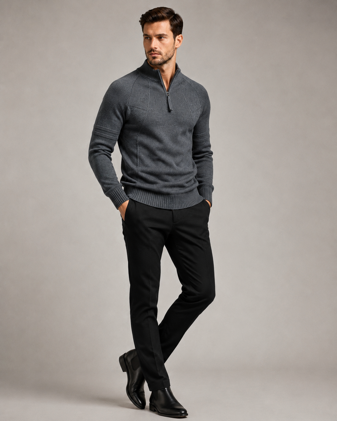 Charcoal gray fitted knit quarter-zip sweater with raglan sleeves, raised chest seams, and ribbed trim on a male model.