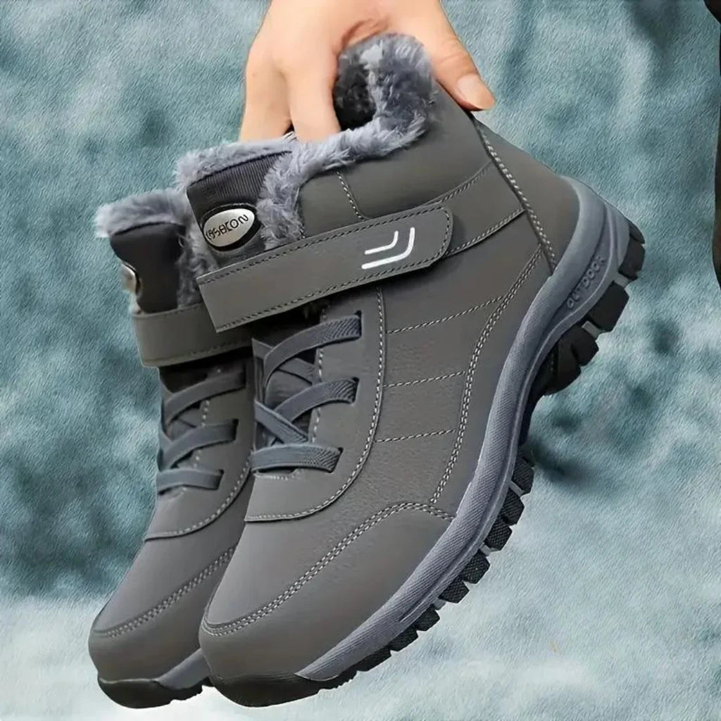 Gray fleece-lined ankle boots for men with lace-up closure, buckle strap, and rugged anti-slip sole