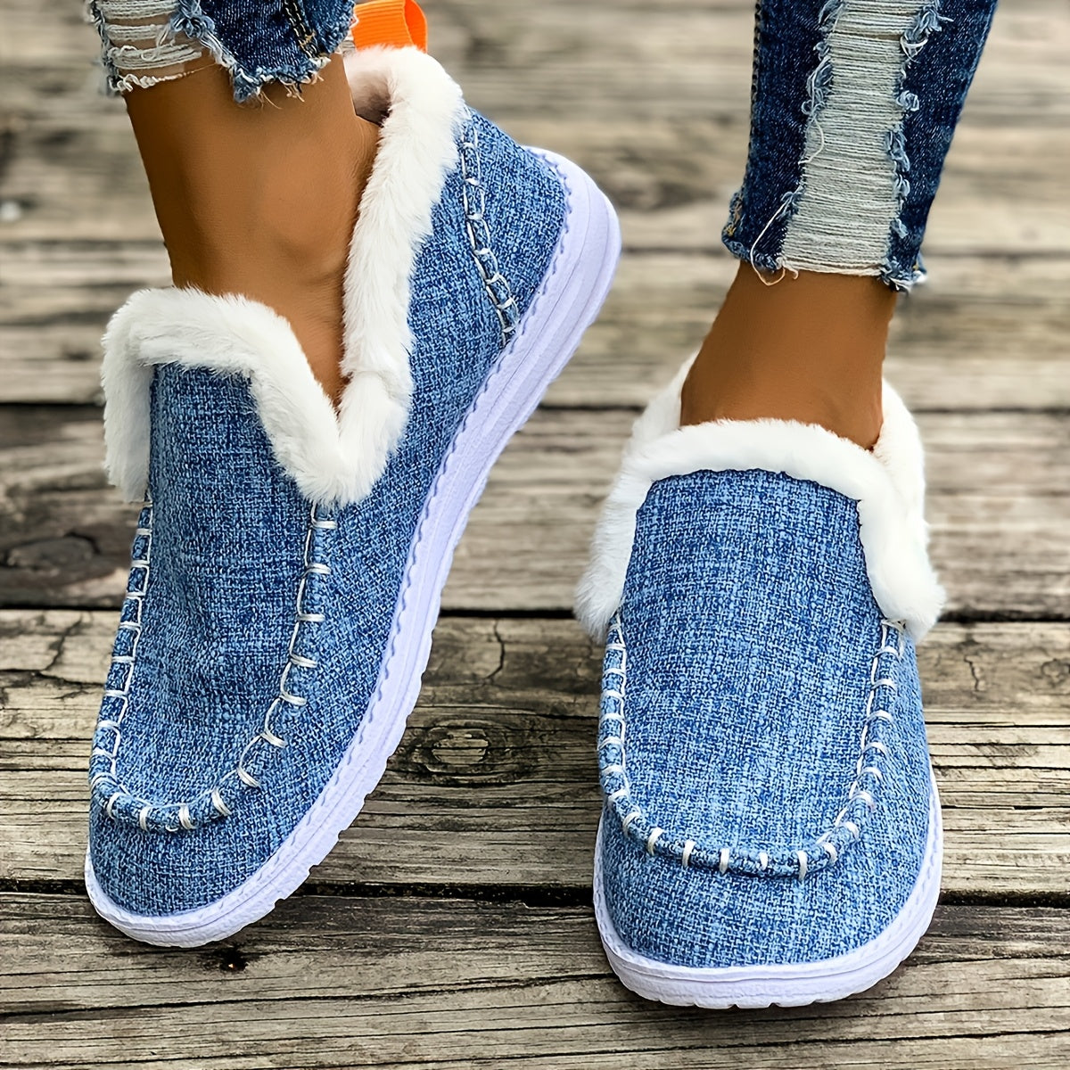 Blue fleece-lined slip-on sneakers for women with soft fur lining and textured knit upper