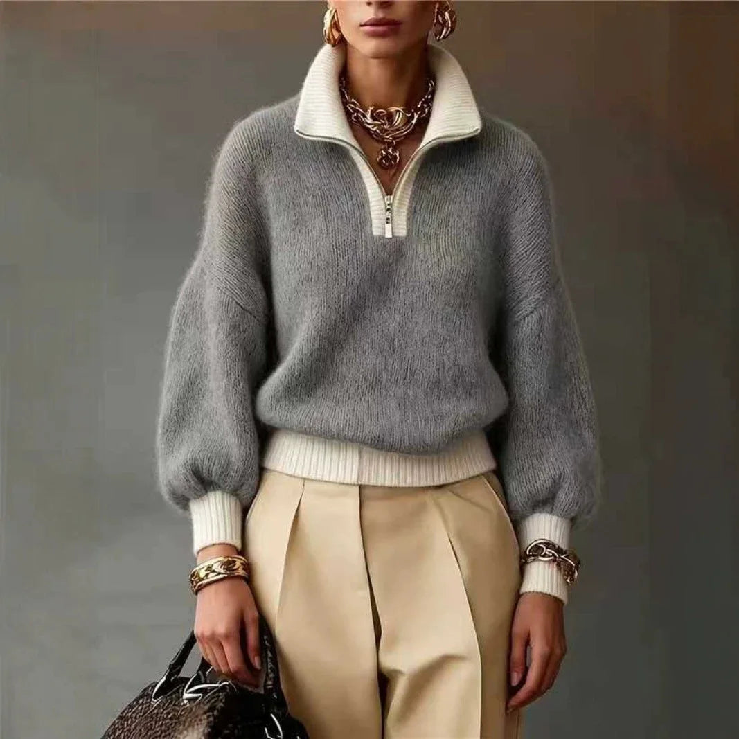 Gray fuzzy knit quarter-zip sweater with cream contrast trim, balloon sleeves, and ribbed cuffs.