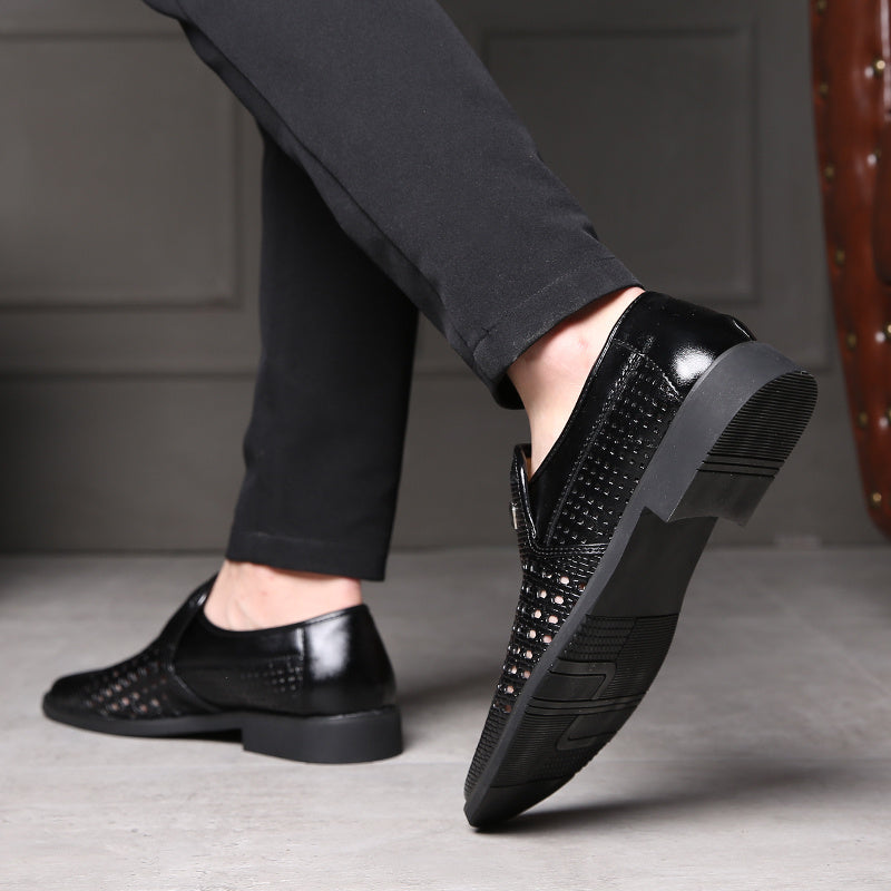 Black woven calfskin leather loafers with breathable perforated upper and durable slip-resistant black outsole, shown while walking.