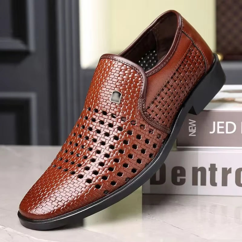 Brown woven calfskin leather slip-on loafer with breathable perforated design and flexible black sole, displayed on stacked books indoors.