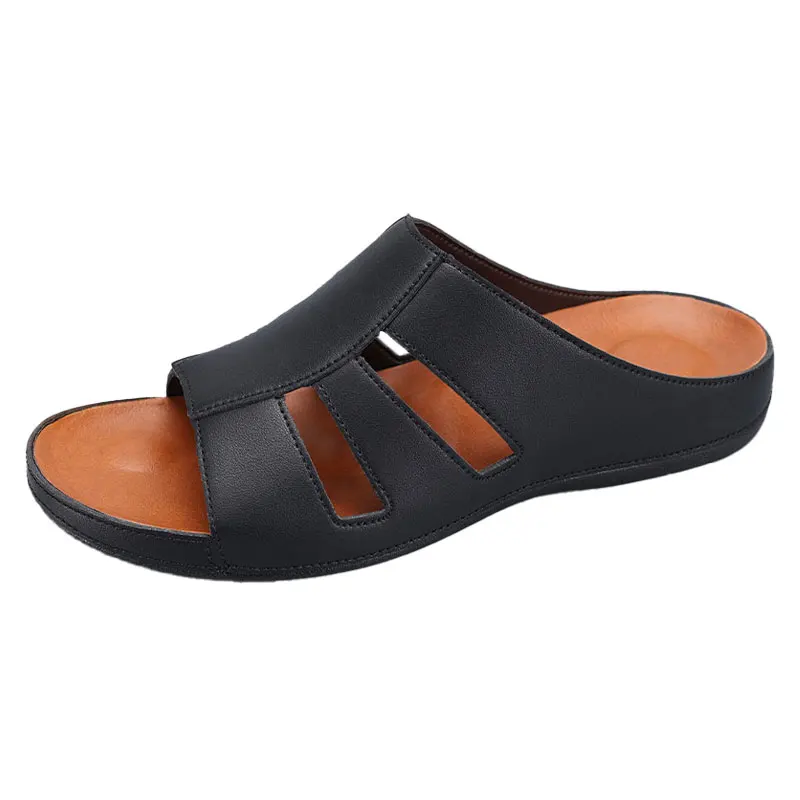 Side profile product shot of a black leather slip-on sandal on a plain white background, showing the cutout straps and orange footbed.