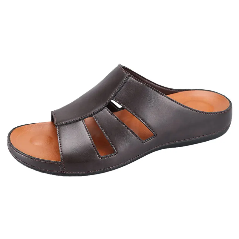 Side profile product shot of a chocolate brown leather slip-on sandal on a plain white background, showing the cutout straps and orange footbed.