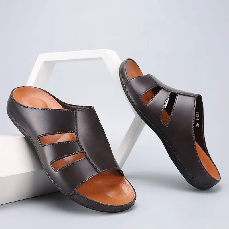 Pair of chocolate brown leather slip-on sandals with cutout straps, styled leaning against a white geometric display prop.
