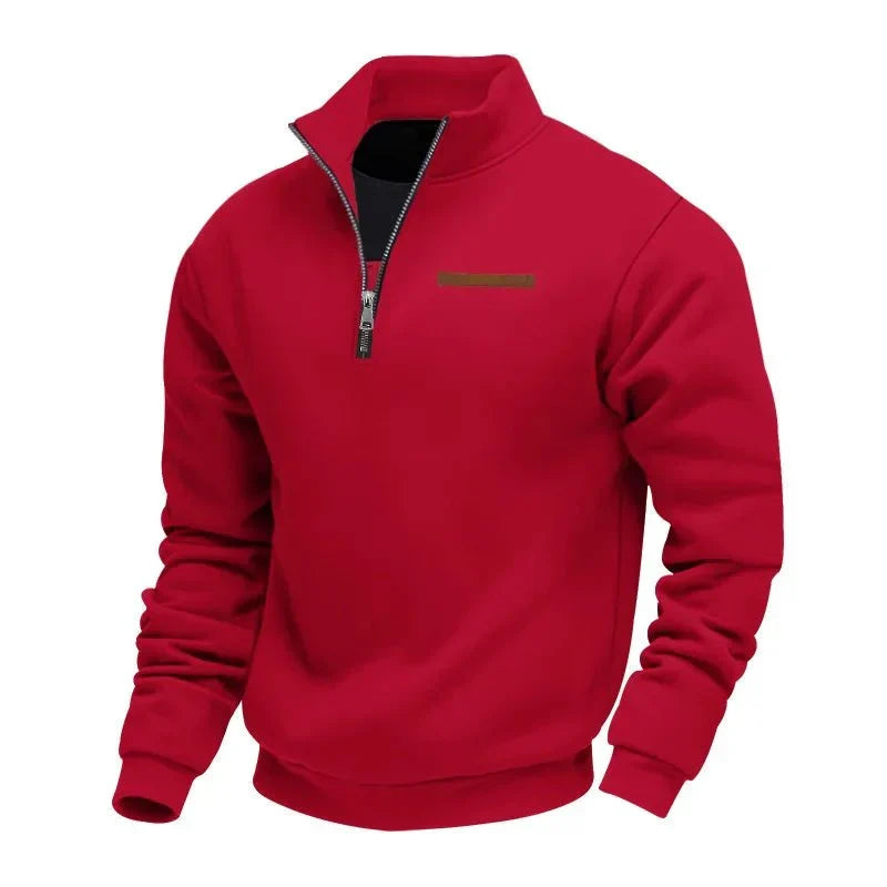 Red half-zip fleece sweatshirt with a stand collar, ribbed cuffs, and chest accent detail on a white background.