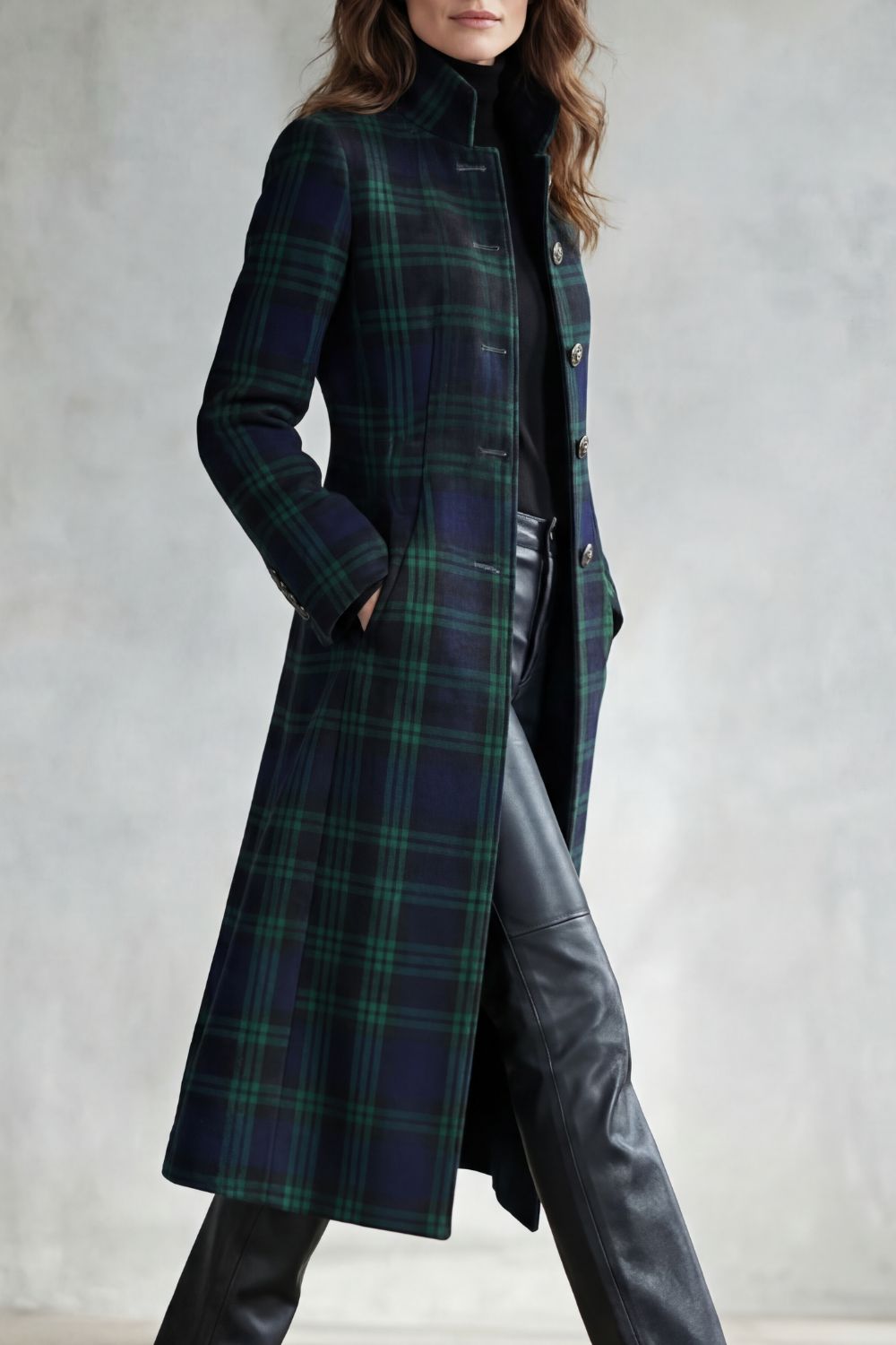 Tailored longline wool-blend coat in a dark green and navy Highland check with a structured button-front silhouette.
