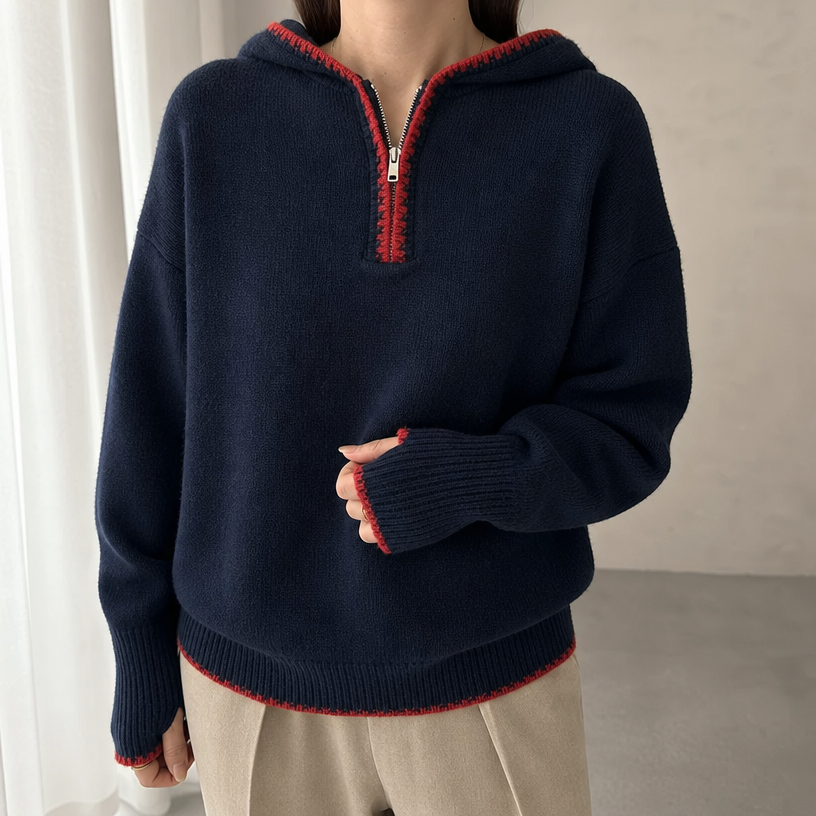 Navy hooded knit half-zip pullover worn by a female model, close-up front view
